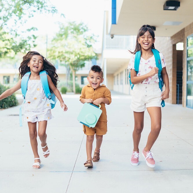 Children wearing Kohl's backpack and clothes